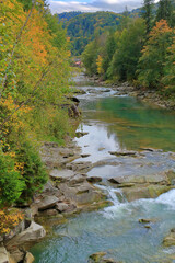 Mountain river in the autumn forest.