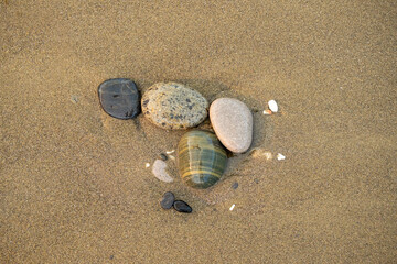 Fototapeta na wymiar Background of small stones by the beach