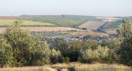 Naklejka premium Landscapes of the Northern regions of Moldova. A pastoral panorama with nature. Moldovan villages and houses and streets.