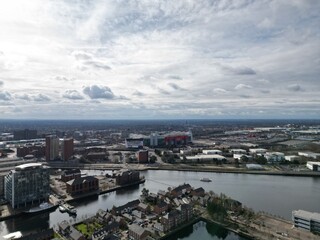 Obraz premium Aerial view of modern buildings and landmarks next to the river. Taken in Salford Quays England. 