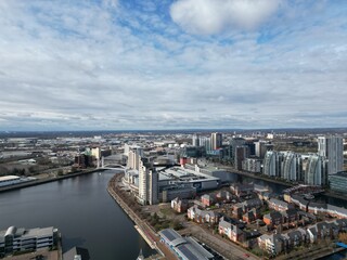 Fototapeta na wymiar Aerial view of modern buildings and landmarks next to the river. Taken in Salford Quays England. 