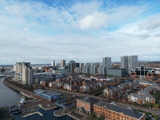 Aerial view of modern buildings and landmarks next to the river. Taken in Salford Quays England. 
