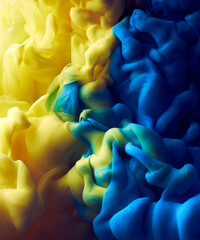 Splash of blue and yellow colors paint pigment abstract texture background