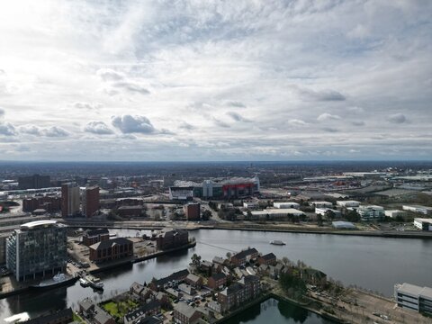 Aerial view of modern buildings and landmarks next to the river. Taken in Salford Quays England. © ReayWorld