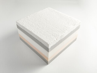 Mattress bed sponge section on the isolated white background.