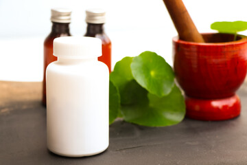 herbal pills or vitamins and green leaf, bio supplement