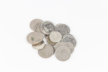 Pile of old coins isolated on white background with clipping path.