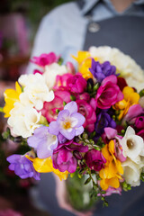 Bouquet with multi colored mimosa. Holiday, Easter, Mothers Day. small business, professional, date, wedding, pink, purple, purple, white, yellow. Mockup, copy space, advertising, postcard