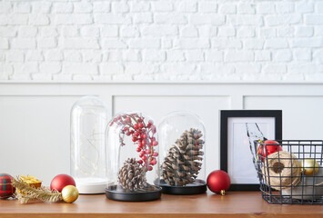 Christmas and new year accessory on the table and white background, cone, tree, frame.