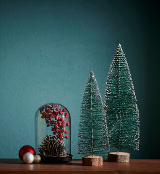 Christmas and new year accessory on the table and green background, cone, tree, frame.