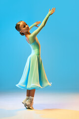 Valse. Portrait of little flexible girl in stage outfit, dress dancing ballroom dance over blue background. Concept of beauty, professional dances, skills - obrazy, fototapety, plakaty