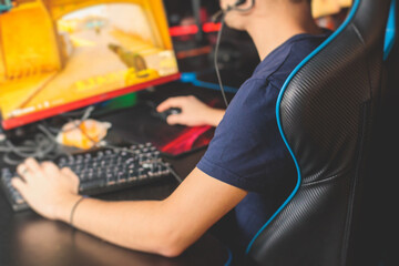 Cyber sport e-sports tournament, team of professional gamers, gamer's hands on mouse and keyboard, pushing button, gamers playing in competitive moba, strategy fps game in a cyber games arena club