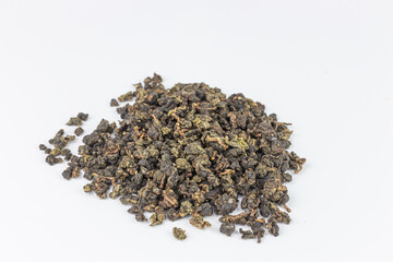 Heap of dry tea leaves isolated on white background with clipping path