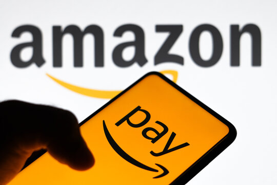 March 16, 2023, Brazil. In this photo illustration the Amazon Pay logo seen displayed on a smartphone and in the background the Amazon logo.