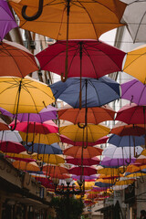Fototapeta na wymiar umbrellas beautiful decoration in a colorful street 