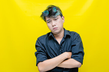 portrait of Asian man in pensive mood looks stressed, depressed, sad and messed up. An irritated man in a rage situation. stressed over the work concept.