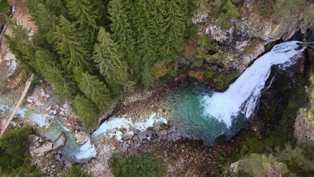 Aerial shots of a waterfall in the Dolomites. Waterfall Cascate di Riva. Drone video of the Riva River in Italy. 