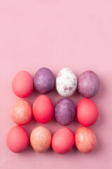 Easter card with colorful eggs on a pink background