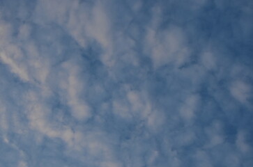 blue sky with loose clouds.