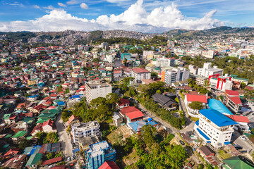Fototapeta na wymiar Baguio City, Philippines - Afternoon aerial of the skyline of the city extending up to the hills.