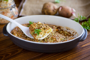 potato casserole with cabbage and spices in a ceramic form
