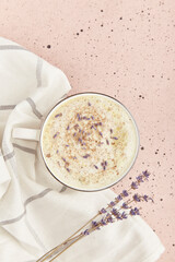 Stylish modern aesthetic lavender coffee with flowers flat lay
