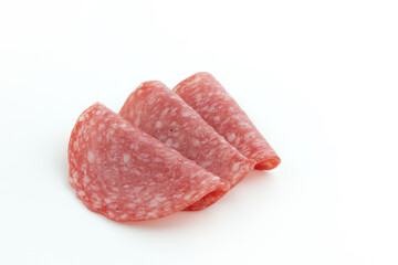 salami sausage cut into pieces isolated on white