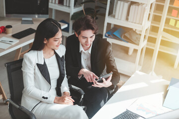 business men and women Conversation and rejoicing while working in the office