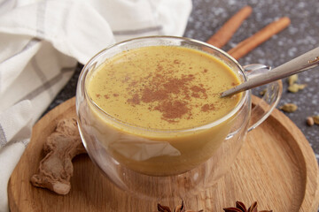 Natural indian masala tea. Traditional hot drink with milk and spices, cardamom, star anise, cinnamon close up