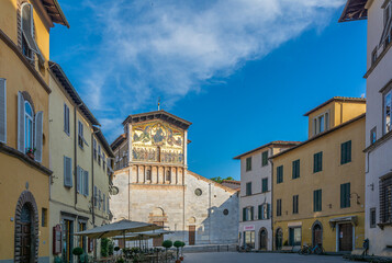 Naklejka premium The Basilica of San Frediano , a Romanesque church in Lucca, Italy, situated on the San Frediano square - Lucca , Tuscany, Italy - may 30, 2021