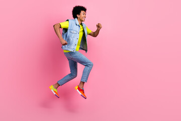 Profile side full length photo of positive funky man wear stylish clothes empty space low price offer isolated on pink color background