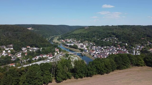 Aerial drone view of the small German village called Bad Karlshafen. Old white European buildings in a touristy town on the river Wezer.