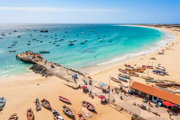 Pier and boats on turquoise water in city of Santa Maria, Sal, Cape Verde - 581816976