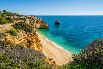 Fototapeta na wymiar Beautiful cliffs and rock formations at Marinha Beach in Algarve, Portugal