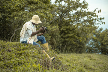 Naklejka na ściany i meble afro farmer man listening to radio
