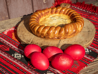 easter red eggs and sweet bread know as pasca in romanian