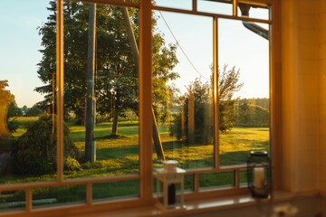 Golden sunrise view of the garden from the house