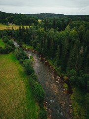 Vertical aerial view of the Amata river and green nature in Latvia