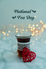 A cup of Tea and a Red heart shape on front of it, National Tea day concept Selective focus