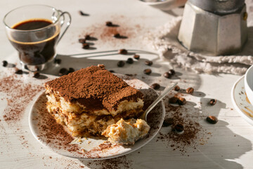 Traditional classic Tiramisu on a white background.