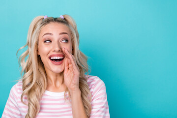 Closeup photo portrait of beautiful girl announces talking secret information touch cheek look mockup isolated on aquamarine color background