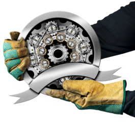 Hands with protective work gloves holding a round metal icon or symbol with many gears (cogwheels of cogs), isolated on white or transparent background with copy space. Png.