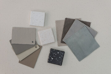 Interior design mood board with leather, fabric and acrylic solid surface samples.