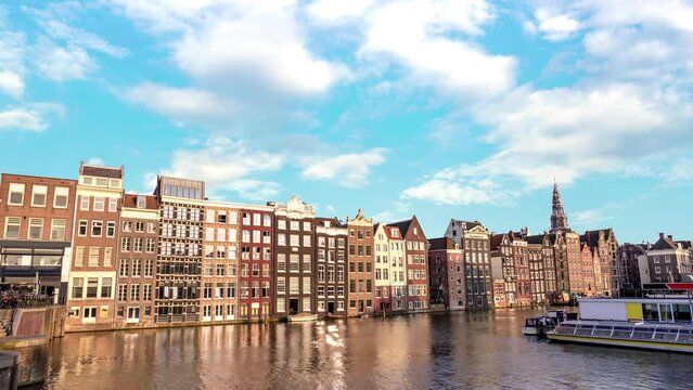Amsterdam Netherlands time lapse 4K, city skyline timelapse at Damrak canal waterfront