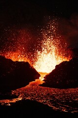 Vertical shot of lava flowing over rocky surface during 2022 Meradalir volcano eruption, Iceland