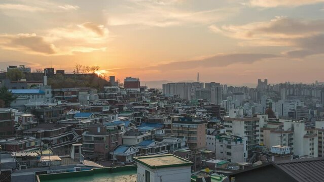Seoul South Korea time lapse 4K, city skyline night to day sunrise timelapse at Seoul city center view from Naksan Park in autumn