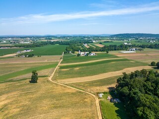 Aerial view of a countryside area with fields and houses