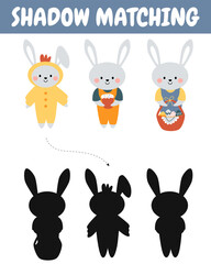 Fototapeta na wymiar Cute bunnies, rabbits shadow matching activity for children. Happy Easter. Find the correct silhouette printable worksheet.
