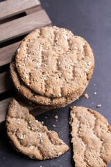 Vertical closeup shot of cereal cookies on a table surface - healthy, crunchy snack concept