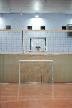 basketball hoop and football goal, in the gym. basketball hoop and football goal, futsal, indoor sports arena, vertical orientation photo
